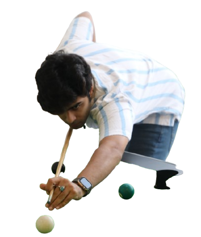 Player aiming a cue stick to take a shot in a game of billiards